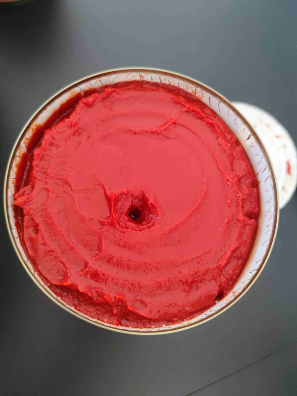 Store Canned Tomato Paste in a Cool and Dry Place with Tomatoes as Primary Ingredient in Tins